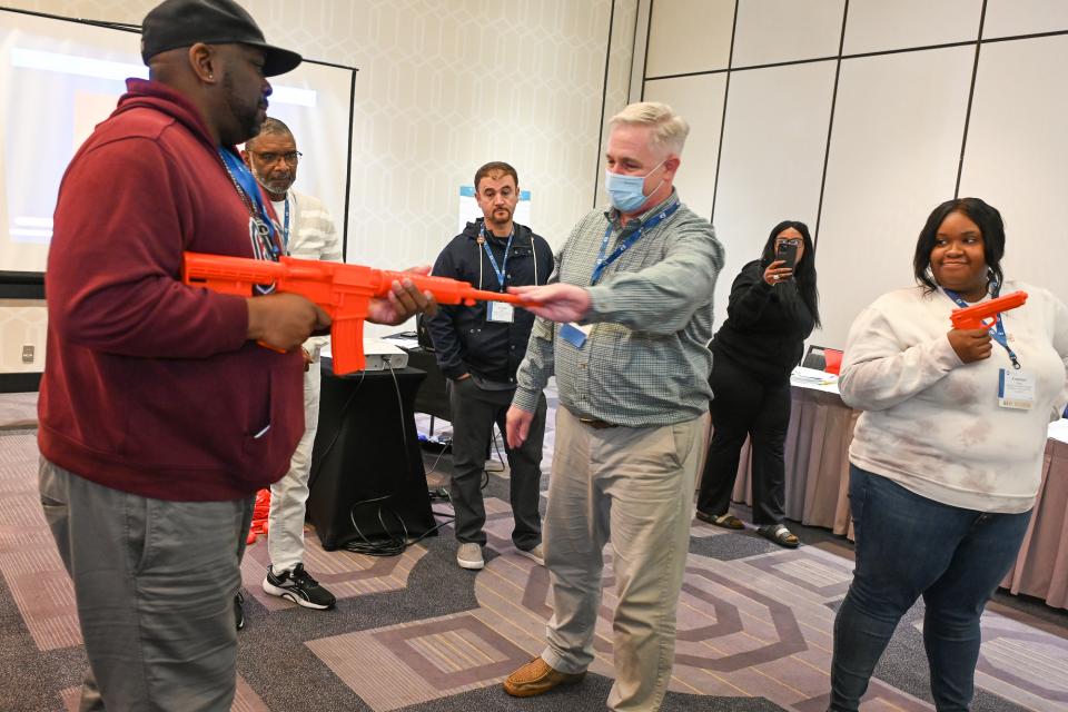 Members doing safety training with fake orange guns