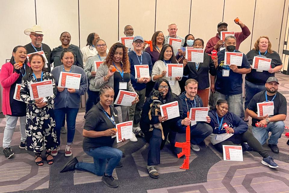 the AVERT graduates group shot with their certificates