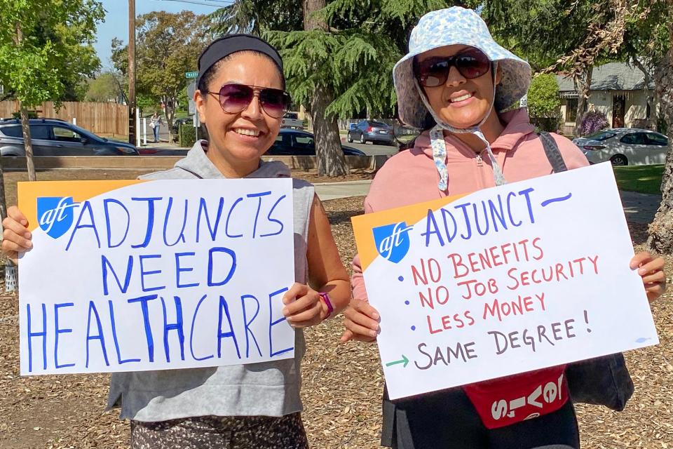 Members holding signs for part-time equity