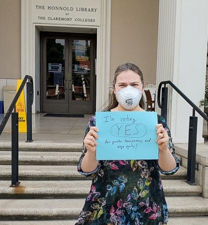 Kirsten Hansen holding union support sign