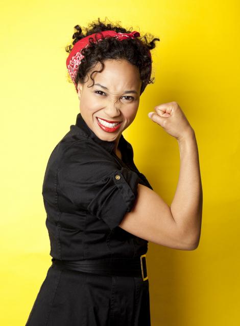 woman dressed as empowered Rosie the Riveter 