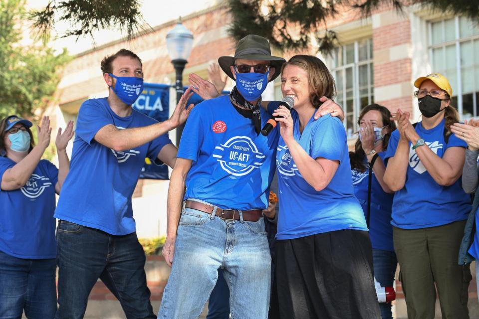 Lecturers celebrate the new contract.