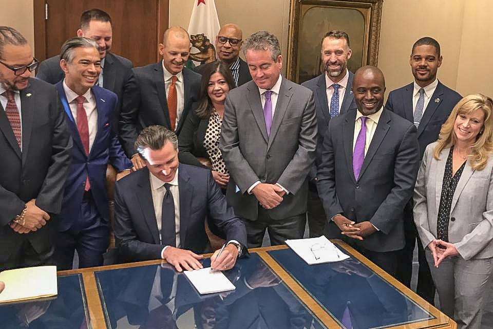 Governor Newsom signs Christy Smith's landmark charter reform bill.