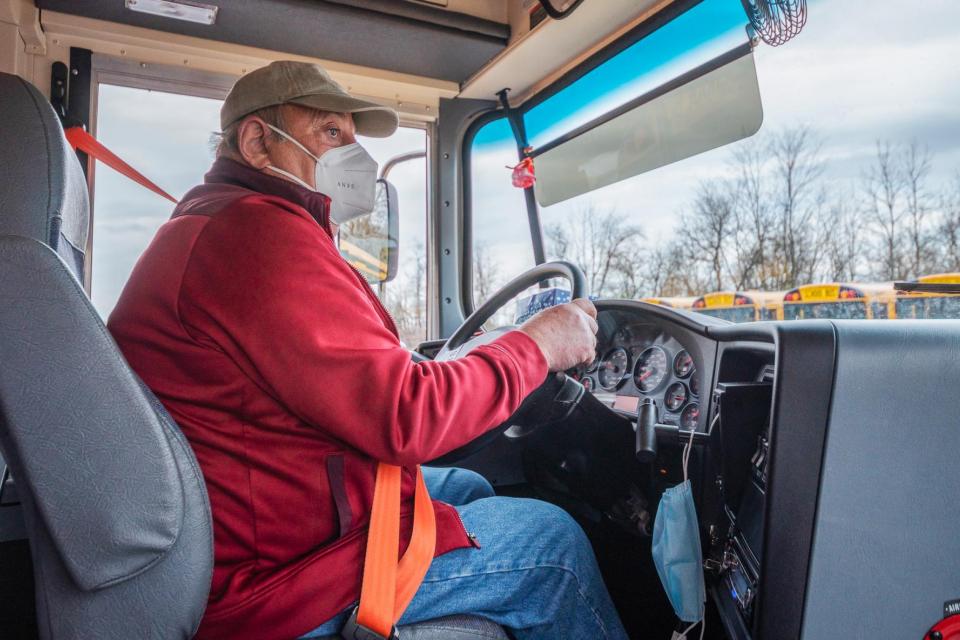 rural bus driver wearing a face mask