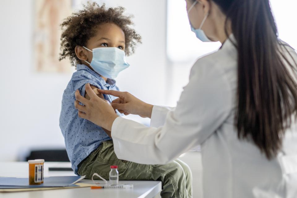 young child getting vaccinated for COVID-19