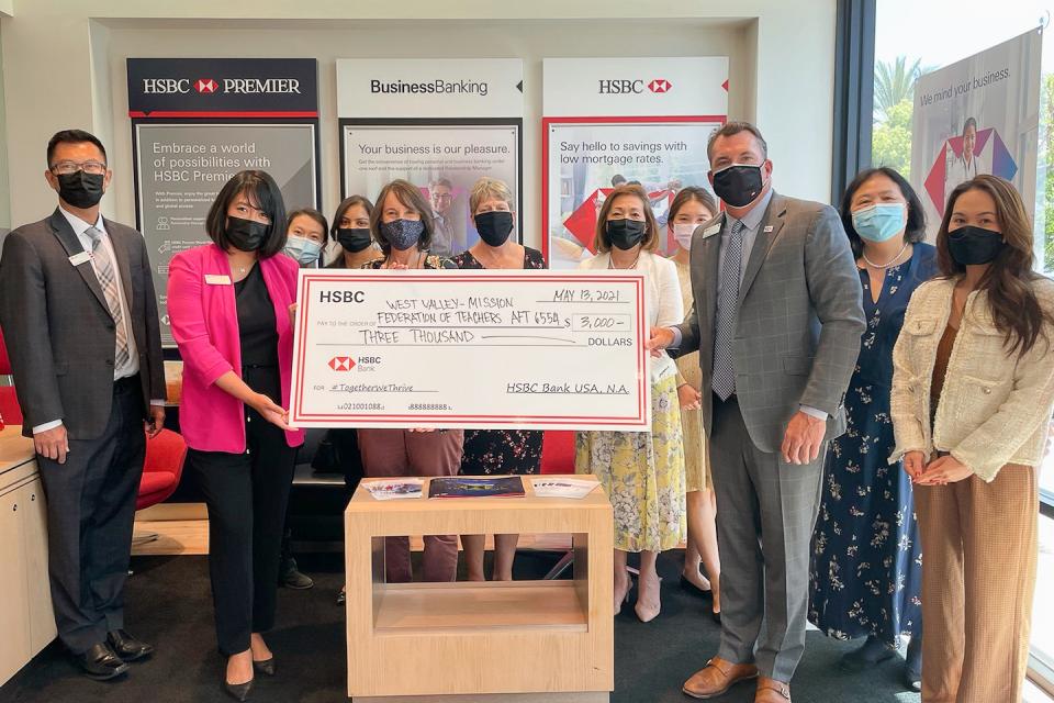 West Valley-Mission Federation receiving check from HSBC, all wearing masks