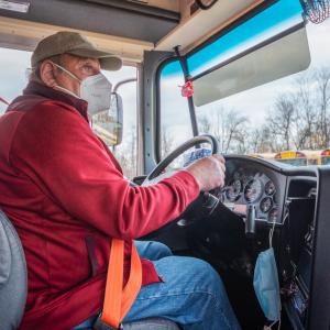 rural bus driver wearing a face mask