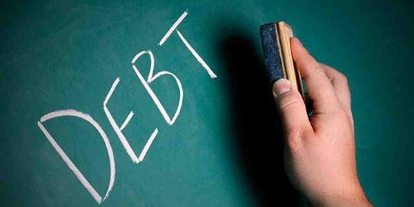 eraser erasing the word debt
